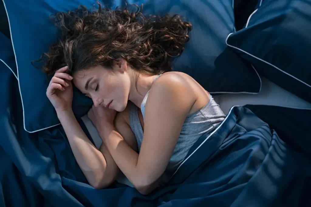 young woman sleeping on the bed